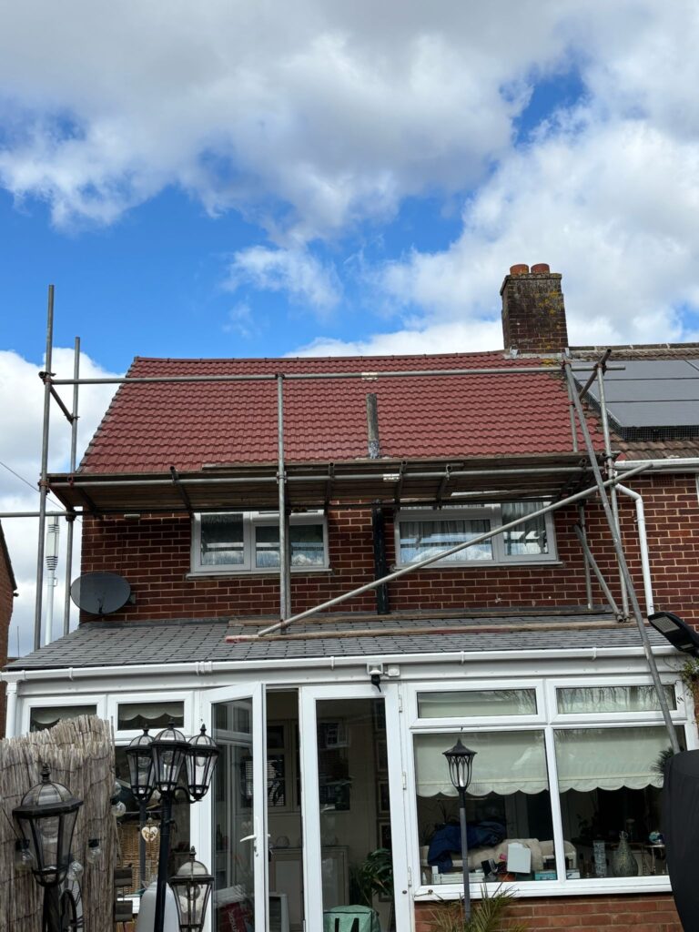 This photo shows a roof in West Sussex before spray foam removal started.